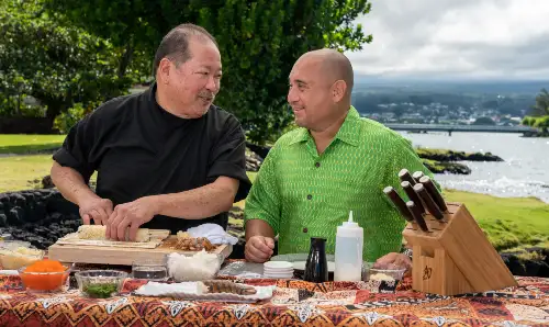 Chef Roy Kaneko’s signature Tempura Lobster Roll served on a sleek plate at Hilo Bay Cafe