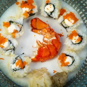 Step-by-step ingredients and final presentation for the Tempura Lobster Roll recipe by Roy Kaneko