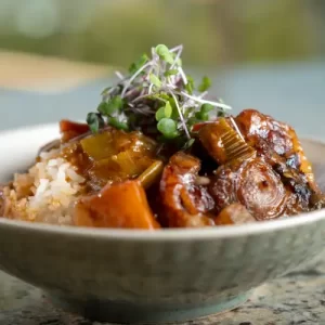 Close-up of rich, savory Papa Keoki's Oxtail Stew recipe created by Zion Thompson.