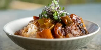 Papa Keoki’s Oxtail Stew by Zion Thompson A bowl of hearty Hawaiian-style Papa Keoki's Oxtail Stew made by Zion Thompson, featuring tender oxtails and potatoes.